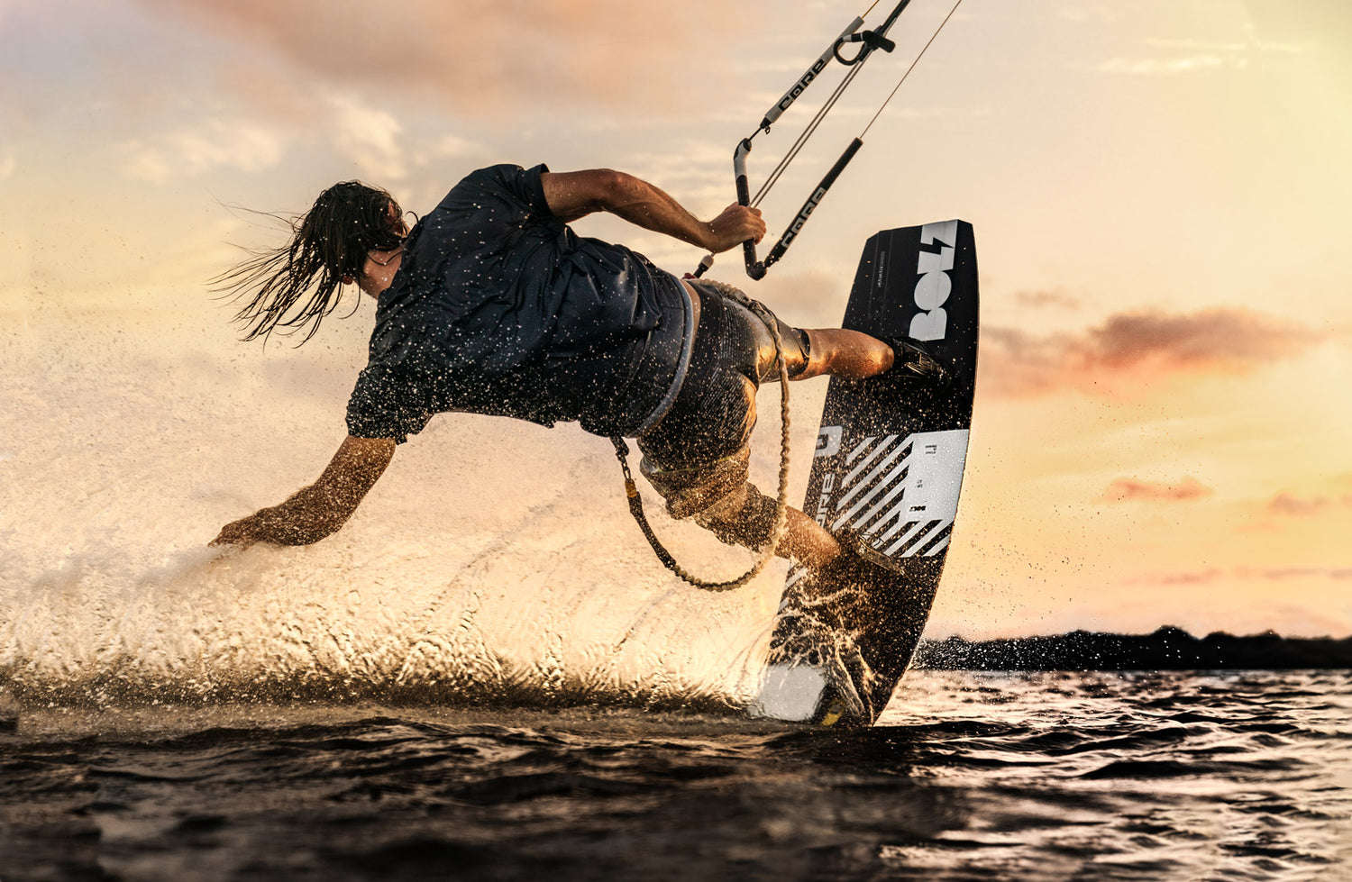 Kitesurfer from CORE Kiteboarding with Kiteboots while Sunset - Canary Islands
